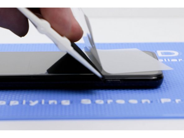 Before sticking the second side down. Pull the film back slightly to meet where the other side is stuck down. If you don't do this, you create an air gap.