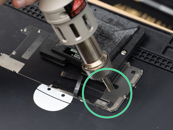 Using a hot air station at 400°C with the airflow set to 100, heat the IC by circling it with your hot air nozzle.