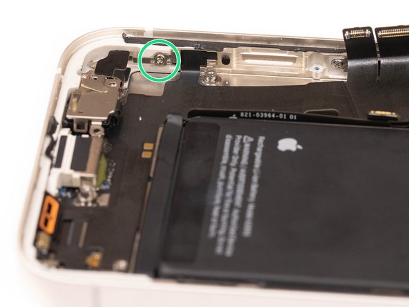 Remove two of the charge port screws located on the sides of the phone, one is located on the left and the other on the right.