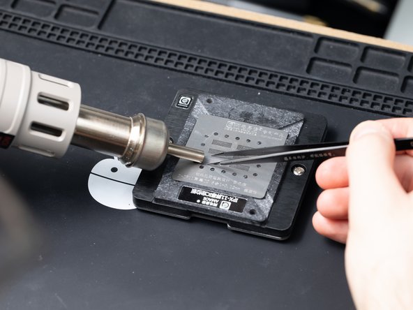 Move the hot air nozzle across the stencil the chip is on.