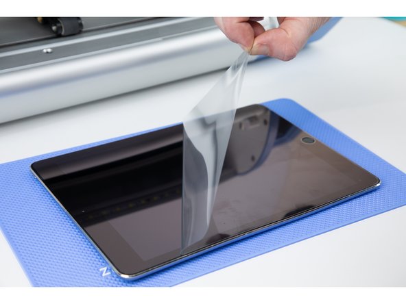 Theres a protective layer on the film. Peel it away.