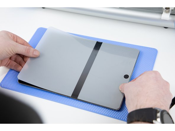 Take your time to line up the film to the corners on your iPad. Make sure there is no overlap on your home button.
