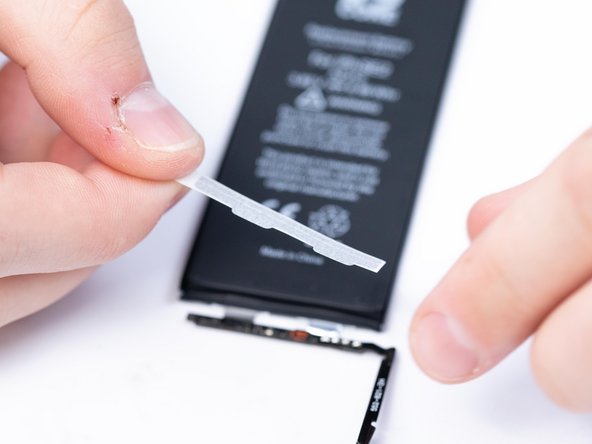 Apply the first protective sticker to the battery. This is a double sided tape that helps prevent the BMS from unfolding.