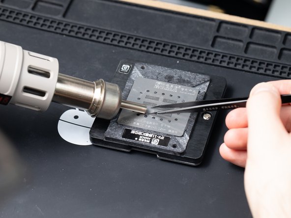 Hold the stencil with tweezers to stop it moving.