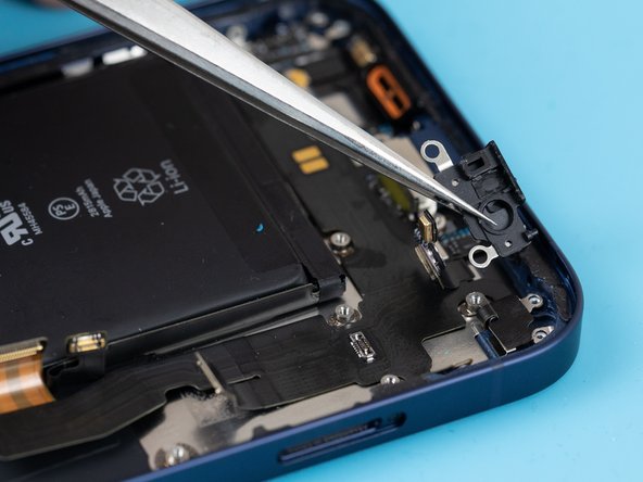 Remove the plastic bracket holding the microphones down.