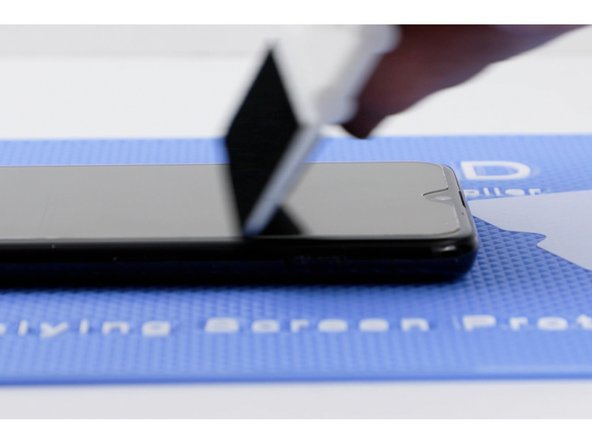 Before sticking the second side down. Pull the film back slightly to meet where the other side is stuck down. If you don't do this, you create an air gap.