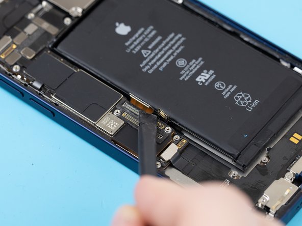 Using a spudger or your fingernail, disconnect the charge port connection flex.