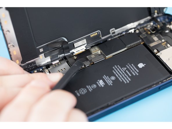 Use a spudger and pry the battery connector up from its socket on the logic board. Make sure your spudger is clean.