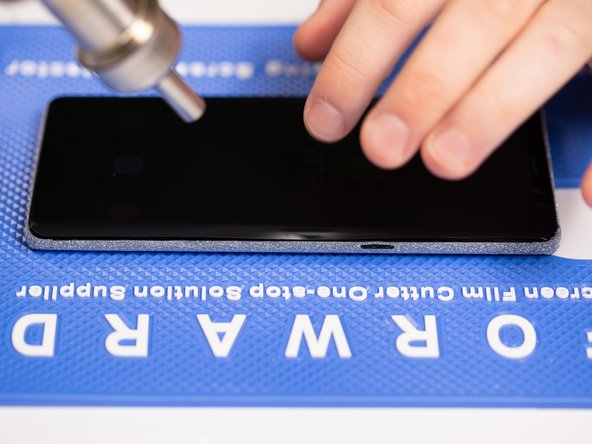 If your phone has curved edges then use a little heat on the edges and fold the film down with you fingers to help it stick to the curved edges.