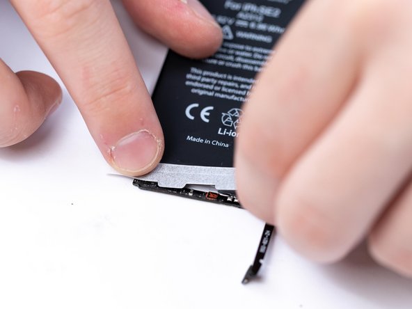 Apply the first protective sticker to the battery. This is a double sided tape that helps prevent the BMS from unfolding.