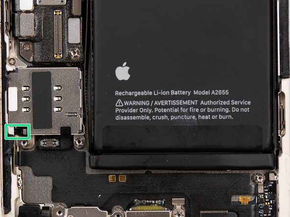 To remove the sim reader you first need to use tweezers to push the sim reader release catch down.