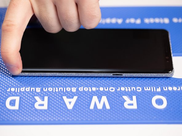 Run your finger back and forth across the edges to ensure the film is stuck down.