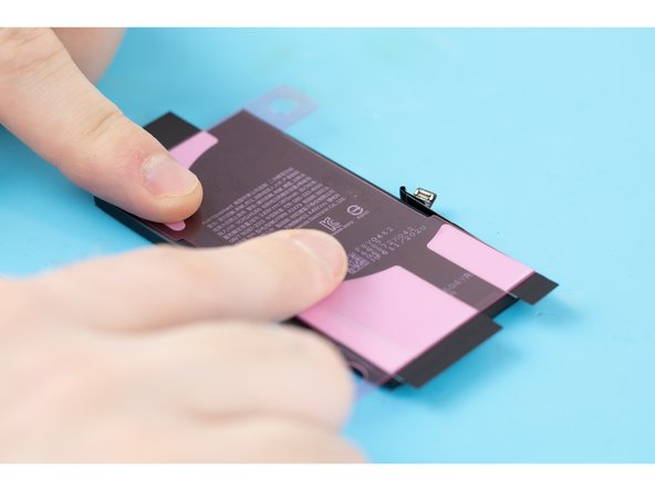 Using your fingers, firmly press the adhesive strips into place.
