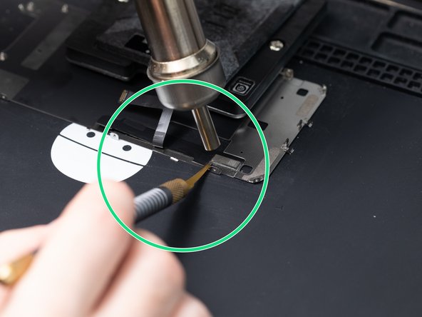 Now the chip is hot we can start prying it off. Use a Qianli chip remover tool or something similar to begin prying the chip up.