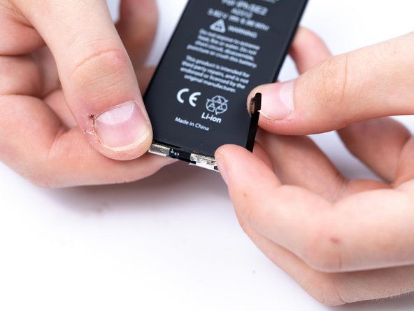 Fold the BMS board into place.