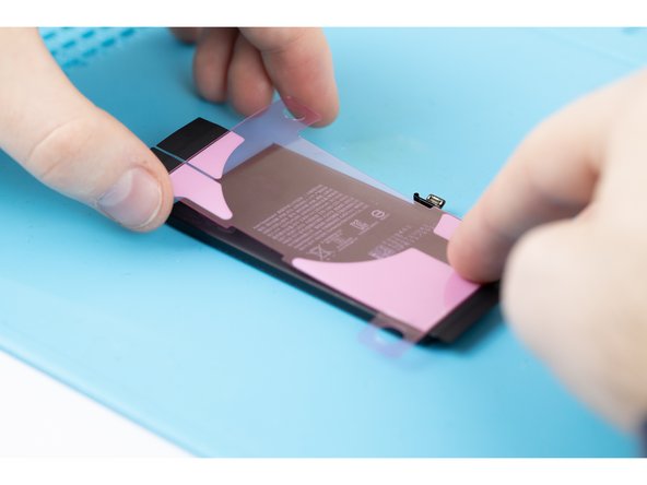 Once the adhesive is suck to the battery, you won't be able to re-position it.