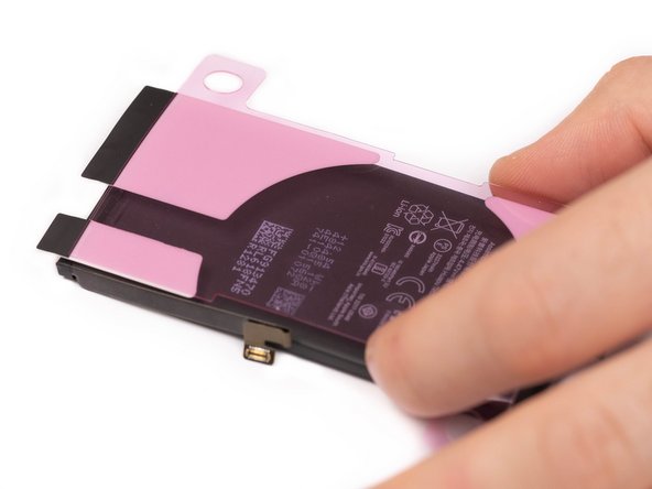 Grab your new battery, line up the adhesives and slowly stick them down to the back side of the battery.