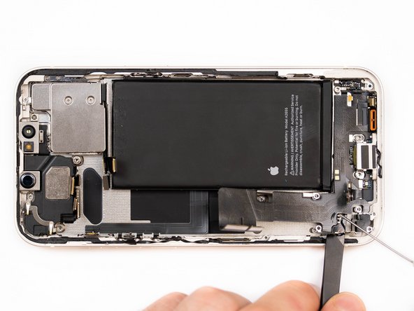 Apply a small amount of IPA to loosen the charge port. This will help you lift it up from the phone case.