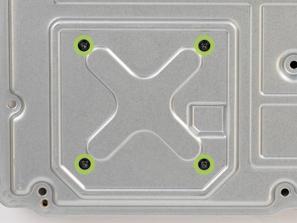 Remove the four 9.4 mm-long screws securing the motherboard to the chassis.