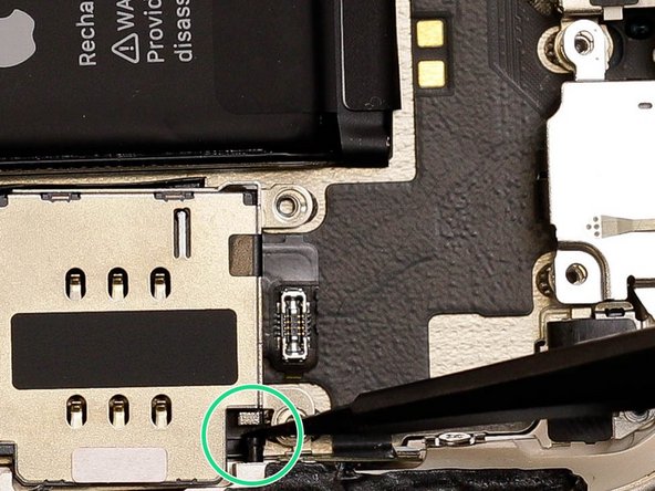 To remove the sim reader you first need to use tweezers to push the sim reader release catch down.