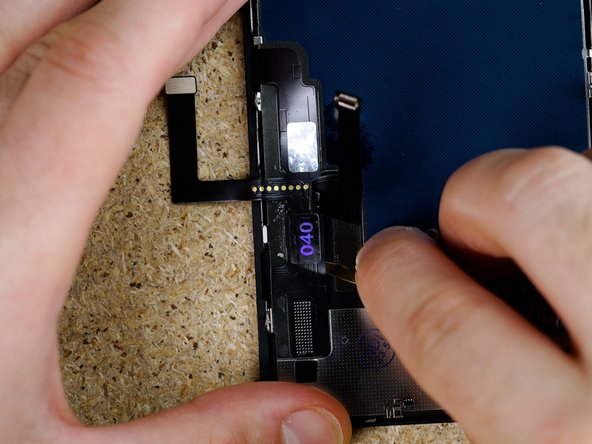 Continue working your way down the flex prying gently in a back and forth motion.