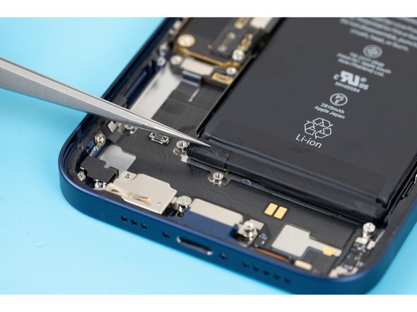 Using tweezers, pull down the first stretch release adhesive pull tab.