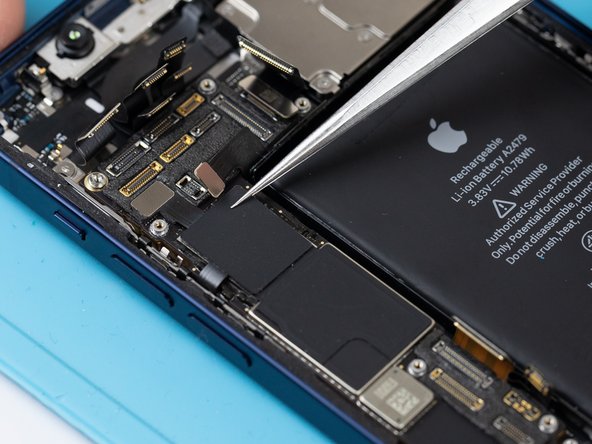 Using a pair of tweezers, disconnect the antenna flex from the memory IC.