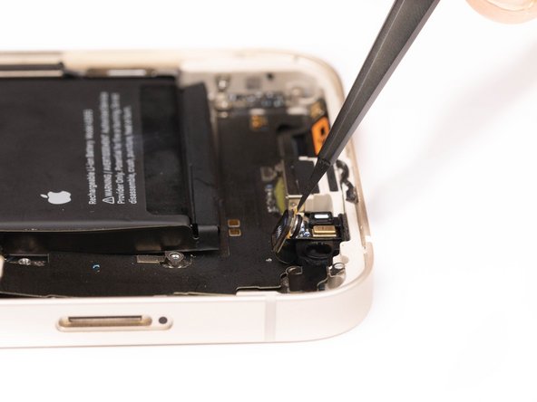 Using a tweezer, disconnect the first microphone from its socket.