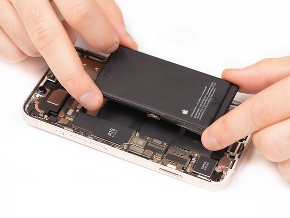 Carefully position the battery and place it into the phone.