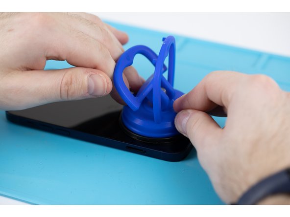 Apply your suction cup to the bottom edge of your phone. Don't place it too far down though, avoid putting it at the very edge of the glass. If you don't have a suction cup, you can purchase yours here.