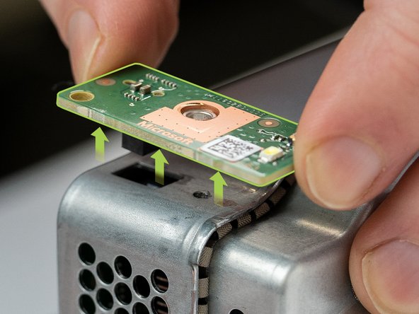 Pry and loosen the power button board with a spudger or your fingers.