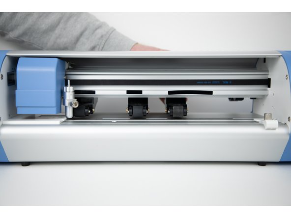 Move the roller wheel as far out as you can with out passing the grip section.