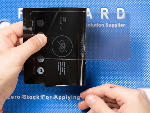 Peel off the cut from the backing sheet. Bending the sheet will help peel the cut off.