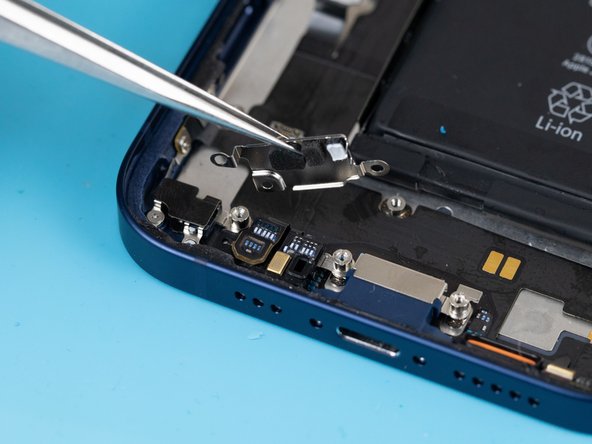 Using a tweezer, pull the protective cover away. The cover is stuck down with an adhesive so you'll need to be firm when removing it.