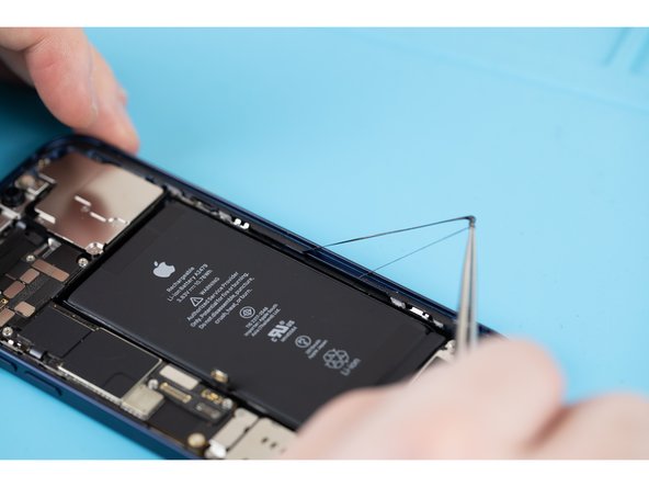 Start by removing the old adhesive that's located around the parameters of your iPhone chassis.