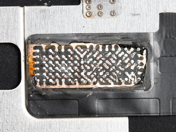 Continue this side to side motion underneath the entire chip to free it from the underfill glue.