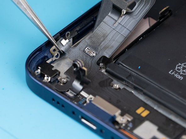 Use a tweezer to disconnect the charge port from the side of the phone.