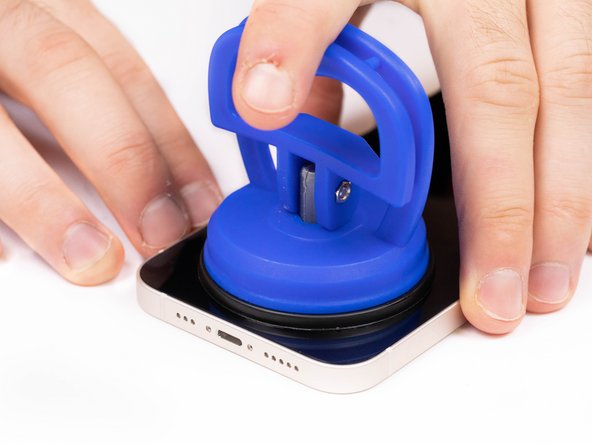 Pull the suction cup away from the phone, this will create a gap between the front panel and rear case.