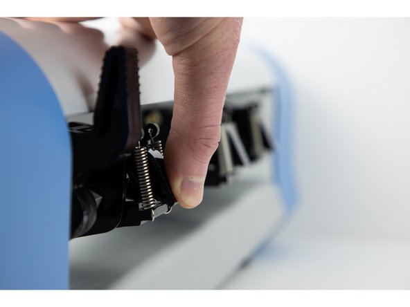 Push the main latch back up and the roller wheel latch back down. This will secure the roller wheel in its new position.