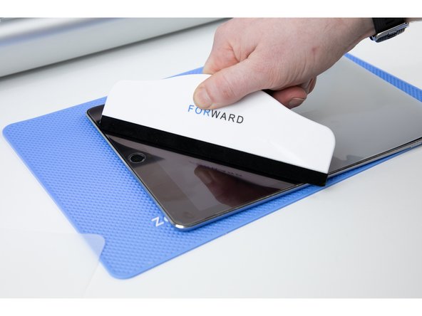 Once you've applied the film, press down on the film a few more times with the application tool to ensure there is no air left underneath.