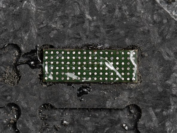 Start by adding some flux to your chip. Apply enough that it can spread in an even layer across the entire chip.