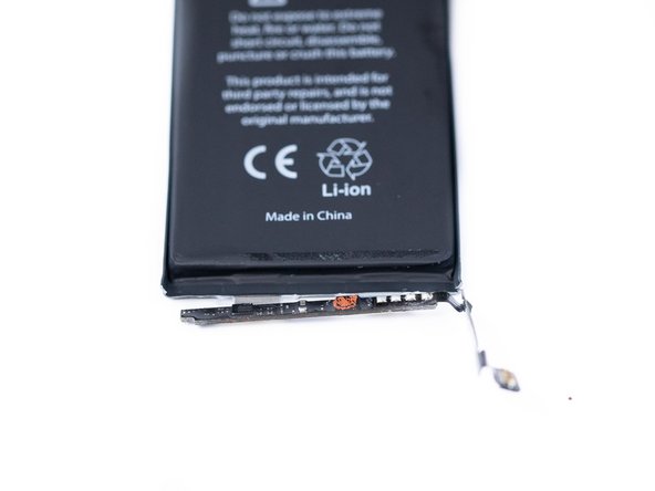 Remove the second protective sticker from the battery.