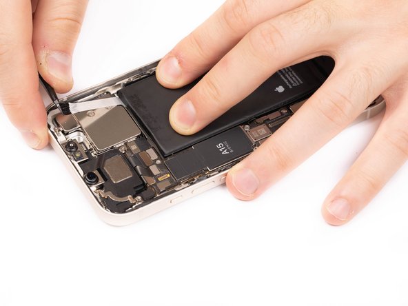 Be careful not to fling the battery from the iPhone as the final adhesive strip comes out.