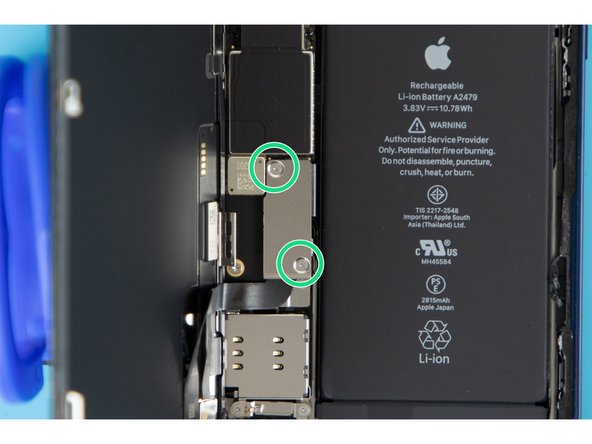 There are two 1.1mm long Y000 screws holding the battery and display connector cover down. You'll need to remove these.