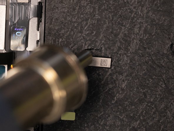 Heat the IC with hot air in a back and forth motion.