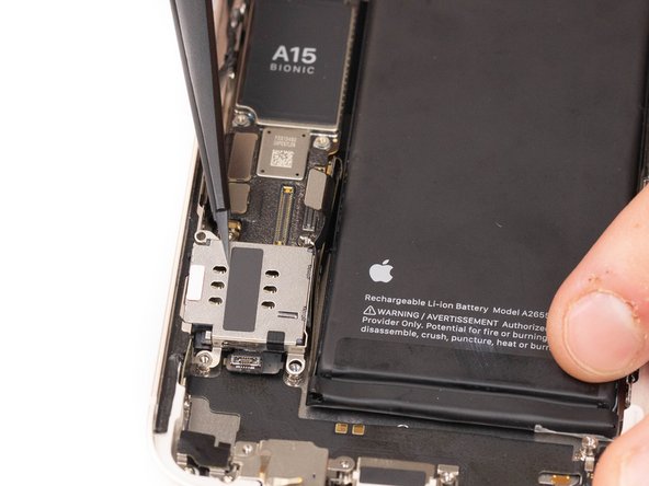 Using tweezers or your fingers, remove the SIM card reader.