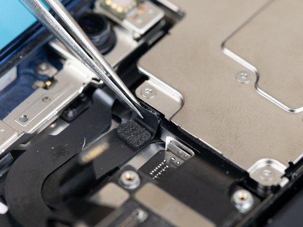 Before removing the front cameras, you'll need to carefully lift up the flex cables from the phone's frame.