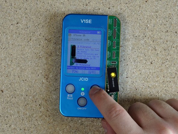 Attach the aftermarket taptic engine and click writing. Once complete, unattach  the taptic engine.