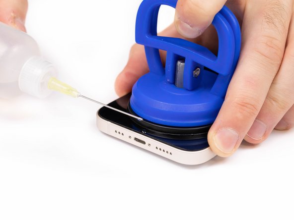 Using a pry tool or plastic card, begin prying the bottom edge of the phone open. You can use some IPA to help loosen the screen if you're struggling.