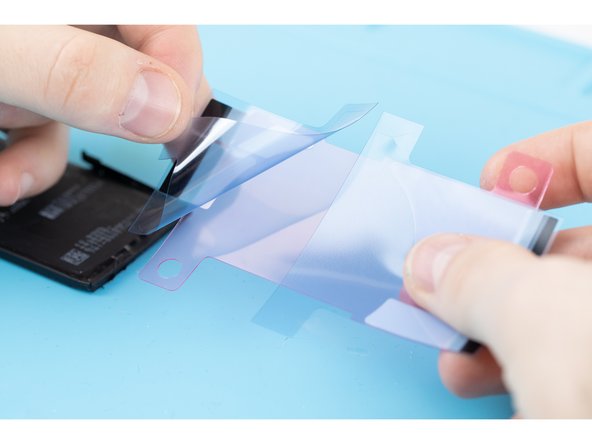 Peel the first protective liner of the adhesive away.